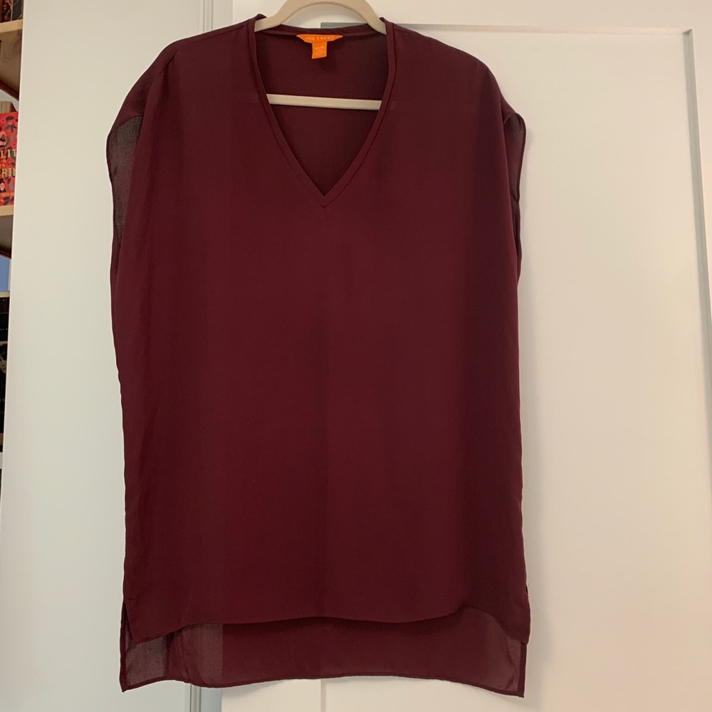 Long burgundy tunic blouse.